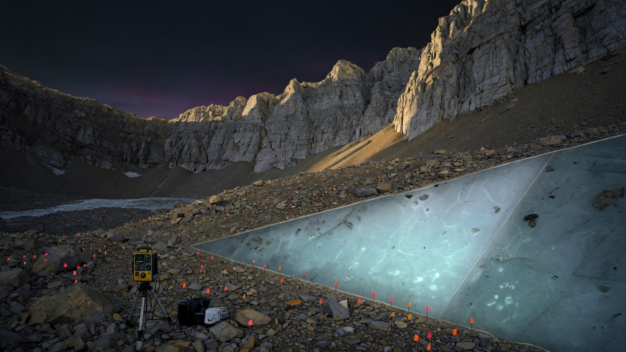 A Utah cirque at dusk: gravimeter on rubble, survey flags, a cutaway of glowing ice under the rocks